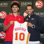 Jun 28, 2024; Atlanta, Georgia, USA; Atlanta Hawks first overall draft pick Zaccharie Risacher poses for a photo with general manager Landry Fields at the Emory Sports Medicine Complex. Mandatory Credit: Brett Davis-USA TODAY Sports