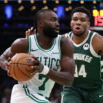 Oct 28, 2024; Boston, Massachusetts, USA; Boston Celtics forward Jaylen Brown (7) drives to the basket defended by Milwaukee Bucks forward Giannis Antetokounmpo (34) during the second half at TD Garden. Mandatory Credit: