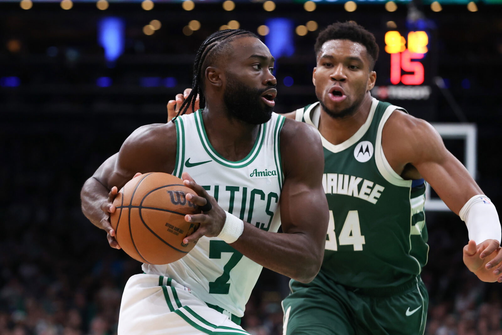 Oct 28, 2024; Boston, Massachusetts, USA; Boston Celtics forward Jaylen Brown (7) drives to the basket defended by Milwaukee Bucks forward Giannis Antetokounmpo (34) during the second half at TD Garden. Mandatory Credit: