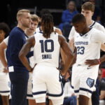 Oct 11, 2025; Memphis, Tennessee, USA; Memphis Grizzlies head coach Tuomas Iisalo huddles with guard Cam Spencer (24), guard Javon Small (10), forward Cedric Coward (23) and center Lawson Lovering (34) during a timeout during the second quarter against the Atlanta Hawks at FedExForum. Mandatory Credit: Petre Thomas-Imagn Images