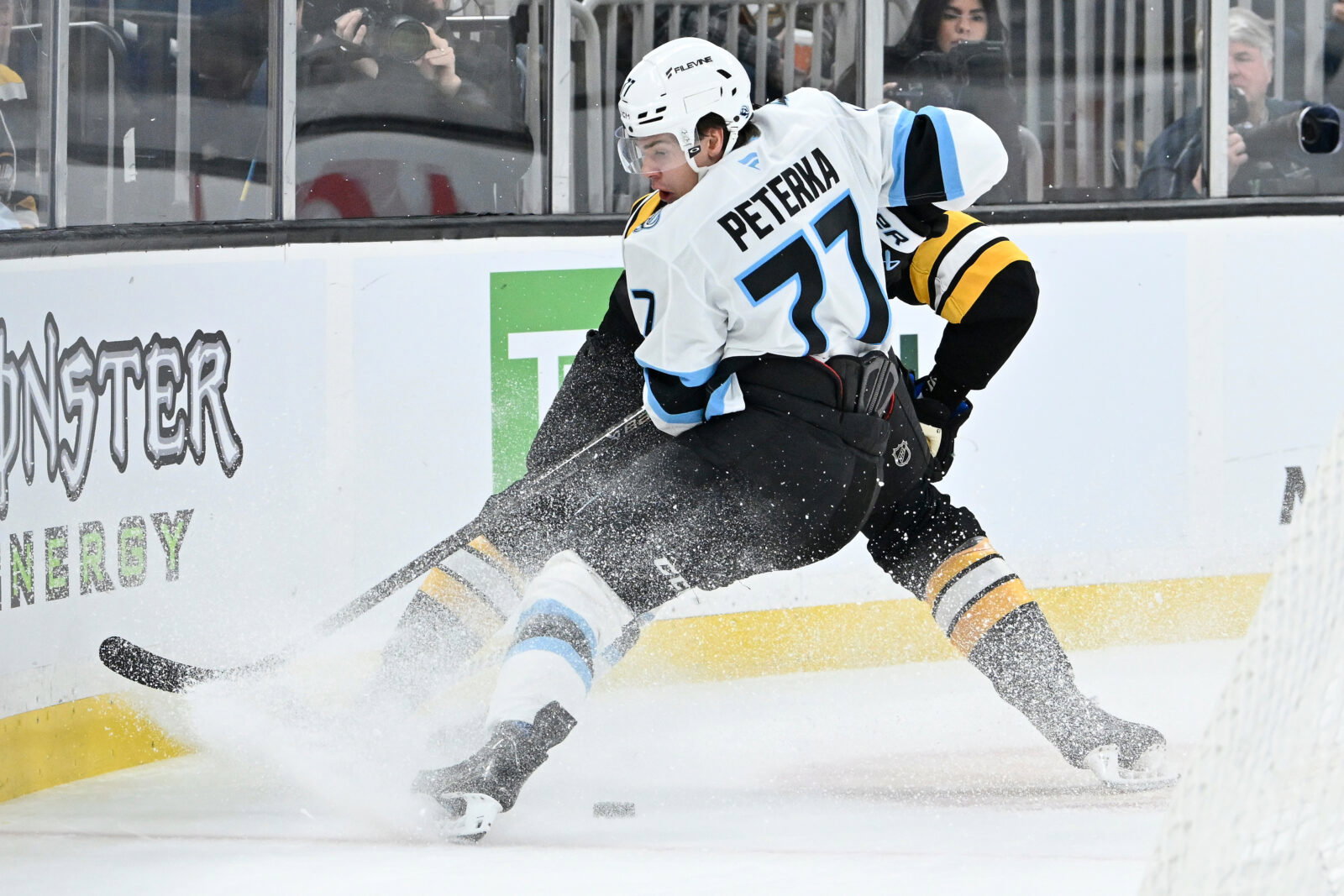 Dec 16, 2025; Boston, Massachusetts, USA; Utah Mammoth right wing JJ Peterka (77) battles with Boston Bruins defenseman Nikita Zadorov (91) for the puck during the second period at TD Garden. Mandatory Credit: Eric Canha-Imagn Images