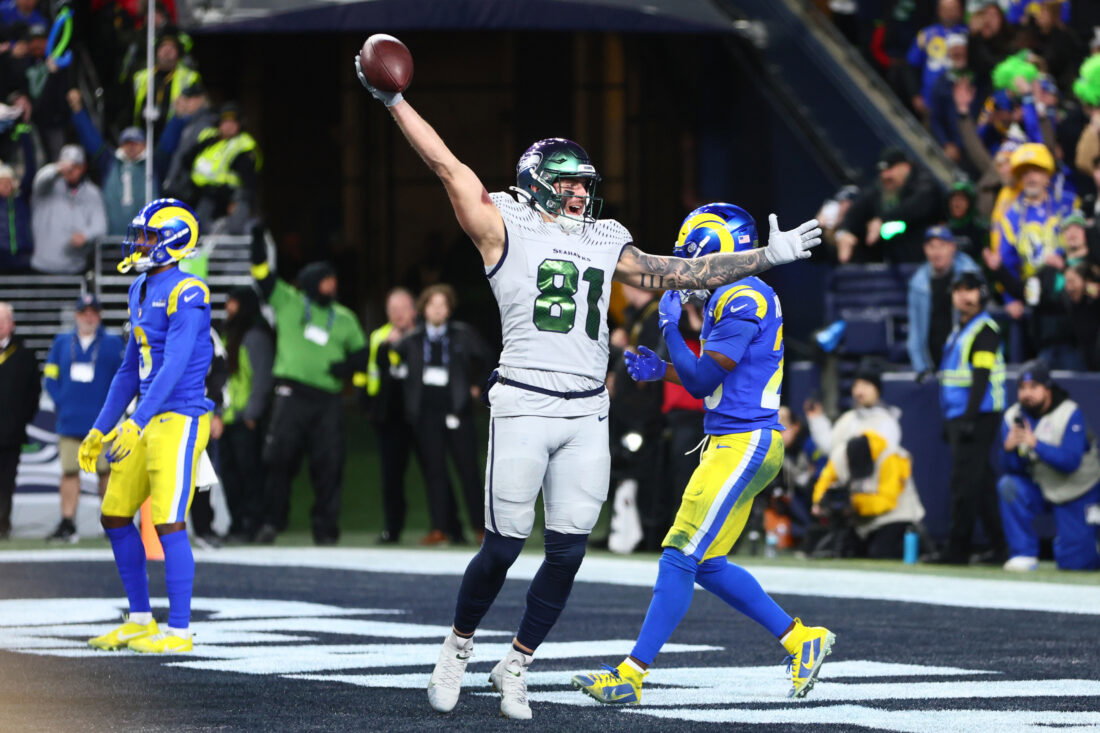 Dec 18, 2025; Seattle, Washington, USA; Seattle Seahawks tight end Eric Saubert (81) celebrates after making a catch for a game-winning two-point conversion against the Los Angeles Rams in overtime at Lumen Field. Mandatory Credit: Kevin Ng-Imagn Images