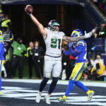 Dec 18, 2025; Seattle, Washington, USA; Seattle Seahawks tight end Eric Saubert (81) celebrates after making a catch for a game-winning two-point conversion against the Los Angeles Rams in overtime at Lumen Field. Mandatory Credit: Kevin Ng-Imagn Images