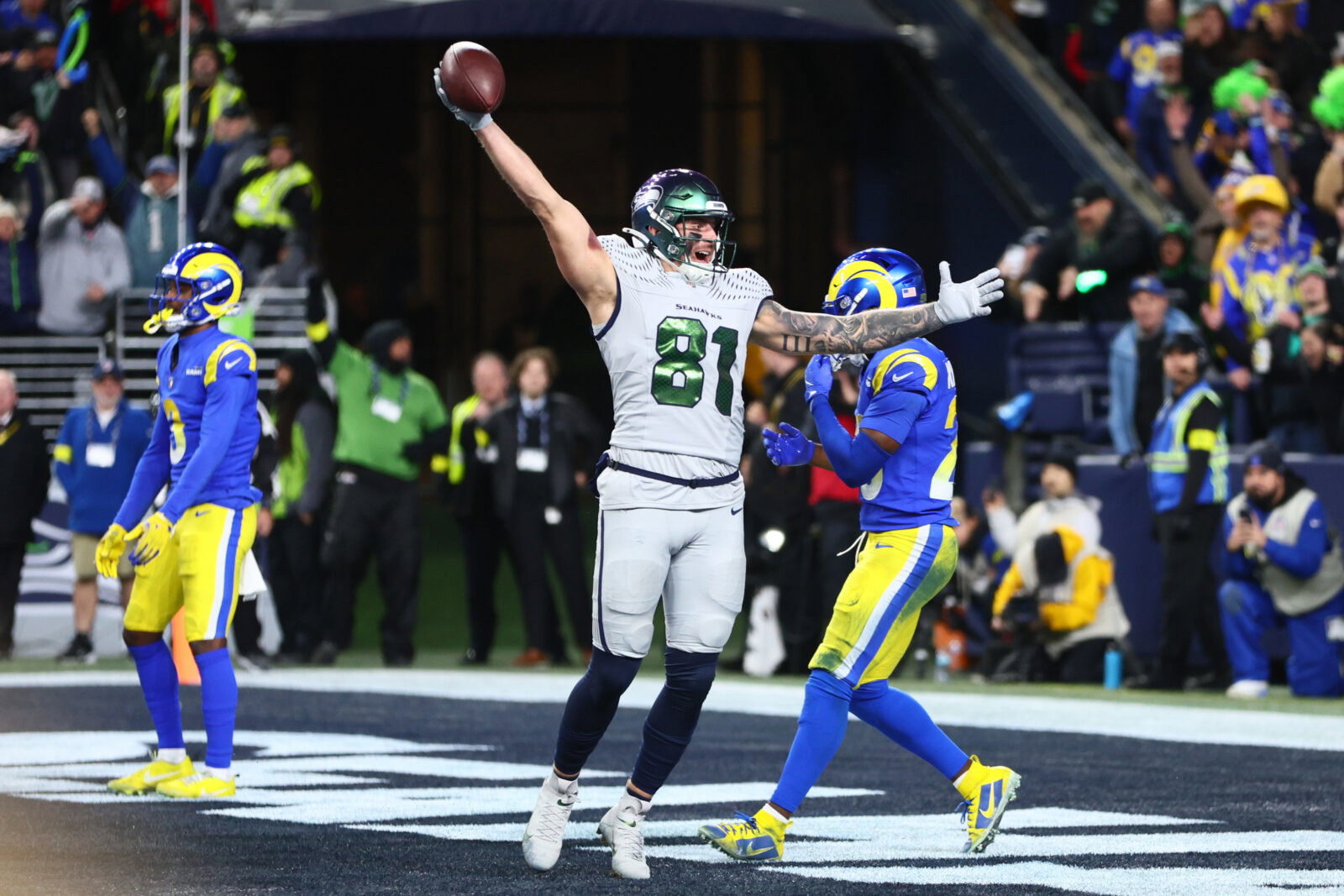 Dec 18, 2025; Seattle, Washington, USA; Seattle Seahawks tight end Eric Saubert (81) celebrates after making a catch for a game-winning two-point conversion against the Los Angeles Rams in overtime at Lumen Field. Mandatory Credit: Kevin Ng-Imagn Images