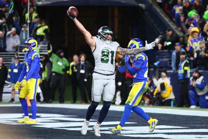 Dec 18, 2025; Seattle, Washington, USA; Seattle Seahawks tight end Eric Saubert (81) celebrates after making a catch for a game-winning two-point conversion against the Los Angeles Rams in overtime at Lumen Field. Mandatory Credit: Kevin Ng-Imagn Images