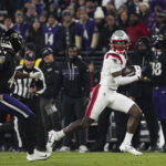 Dec 21, 2025; Baltimore, Maryland, USA; New England Patriots wide receiver Stefon Diggs (8) runs after a catch against Baltimore Ravens cornerback Marlon Humphrey (44) during the first half of the game at M&T Bank Stadium. Mandatory Credit: James Lang-Imagn Images