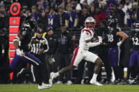 Dec 21, 2025; Baltimore, Maryland, USA; New England Patriots wide receiver Stefon Diggs (8) runs after a catch against Baltimore Ravens cornerback Marlon Humphrey (44) during the first half of the game at M&T Bank Stadium. Mandatory Credit: James Lang-Imagn Images