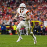 Dec 25, 2025; Kansas City, Missouri, USA; Denver Broncos quarterback Bo Nix (10) rolls out to pass during the second half against the Kansas City Chiefs at GEHA Field at Arrowhead Stadium. Mandatory Credit: Jay Biggerstaff-Imagn Images