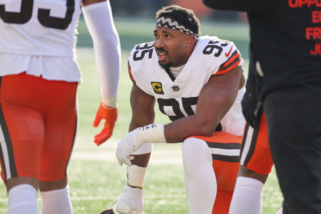 Jan 4, 2026; Cincinnati, Ohio, USA; Cleveland Browns defensive end Myles Garrett (95) kneels on the field during a first half timeout against the Cincinnati Bengals at Paycor Stadium. Mandatory Credit: Joseph Maiorana-Imagn Images