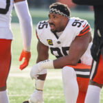 Jan 4, 2026; Cincinnati, Ohio, USA; Cleveland Browns defensive end Myles Garrett (95) kneels on the field during a first half timeout against the Cincinnati Bengals at Paycor Stadium. Mandatory Credit: Joseph Maiorana-Imagn Images