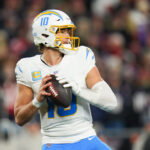 Jan 11, 2026; Foxborough, MA, USA; Los Angeles Chargers quarterback Justin Herbert (10) looks to pass during the third quarter against the New England Patriots in an AFC Wild Card Round game at Gillette Stadium. Mandatory Credit: David Butler II-Imagn Images