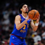 Jan 18, 2026; Denver, Colorado, USA; Denver Nuggets guard Julian Strawther (3) lines up a shot in the second half against the Charlotte Hornets at Ball Arena. Mandatory Credit: Ron Chenoy-Imagn Images