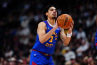 Jan 18, 2026; Denver, Colorado, USA; Denver Nuggets guard Julian Strawther (3) lines up a shot in the second half against the Charlotte Hornets at Ball Arena. Mandatory Credit: Ron Chenoy-Imagn Images