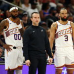 Jan 29, 2026; Phoenix, Arizona, USA; Phoenix Suns head coach Jordan Ott with forward Royce O'Neale (00) and Dillon Brooks (3) against the Detroit Pistons at Mortgage Matchup Center. Mandatory Credit: Mark J. Rebilas-Imagn Images