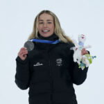 Feb 9, 2026; Livigno, Italy; Zoi Sadowski Synnott of New Zealand on the podium after the women's snowboarding big air final during the Milano Cortina 2026 Olympic Winter Games at Livigno Snow Park. Mandatory Credit: Nathan Ray Seebeck-Imagn Images
