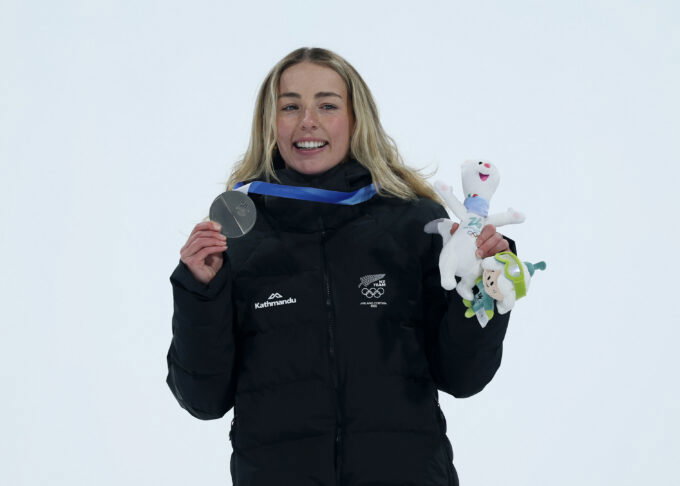 Feb 9, 2026; Livigno, Italy; Zoi Sadowski Synnott of New Zealand on the podium after the women's snowboarding big air final during the Milano Cortina 2026 Olympic Winter Games at Livigno Snow Park. Mandatory Credit: Nathan Ray Seebeck-Imagn Images