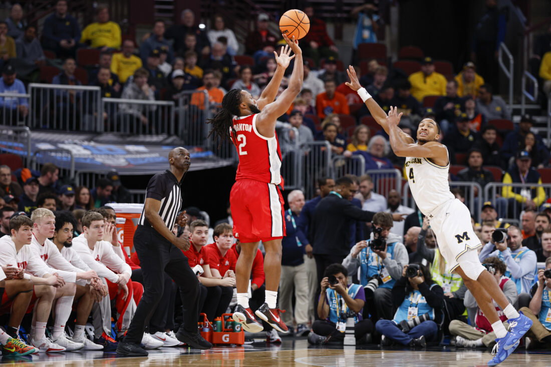 Mar 13, 2026; Chicago, IL, USA; Ohio State Buckeyes guard Bruce Thornton (2) shoots against Michigan Wolverines guard Nimari Burnett (4) during the second half at United Center. Mandatory Credit: Kamil Krzaczynski-Imagn Images