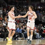 Mar 16, 2026; Chicago, Illinois, USA; Chicago Bulls guard Josh Giddey (3) and forward Matas Buzelis (14) high five during the second half at United Center. Mandatory Credit: Matt Marton-Imagn Images