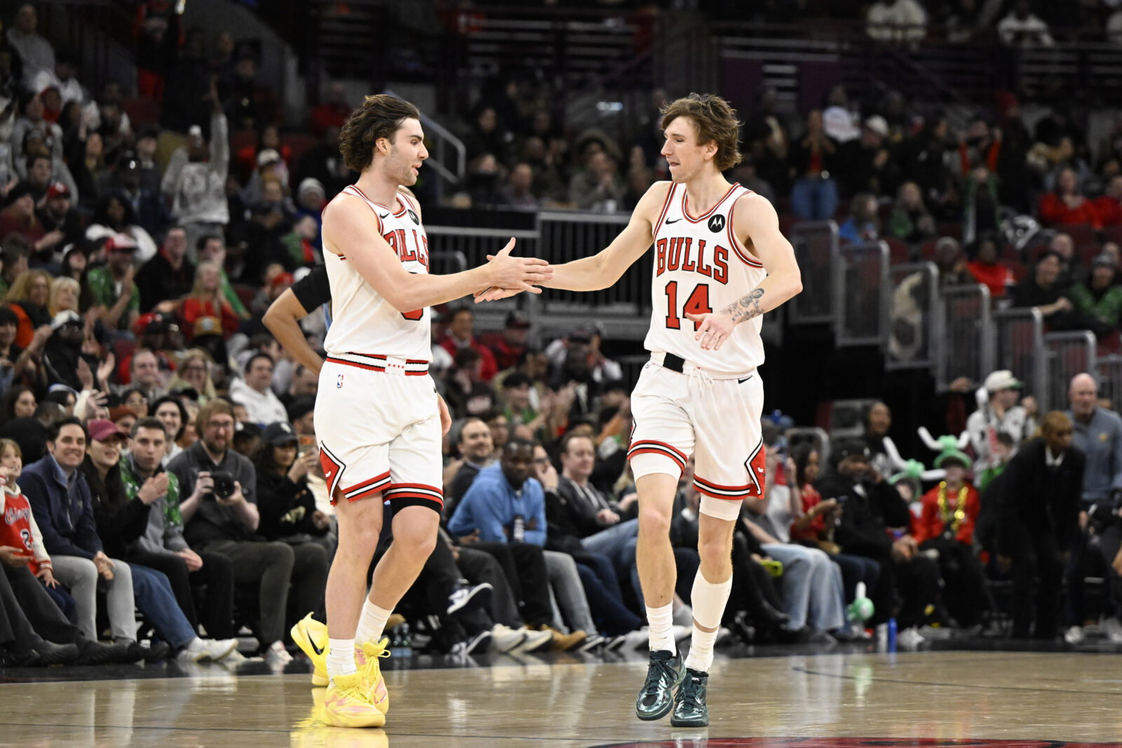 Mar 16, 2026; Chicago, Illinois, USA; Chicago Bulls guard Josh Giddey (3) and forward Matas Buzelis (14) high five during the second half at United Center. Mandatory Credit: Matt Marton-Imagn Images