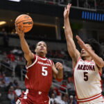 Mar 26, 2026; San Jose, CA, USA; Arkansas Razorbacks guard Darius Acuff Jr. (5) shoots past Arizona Wildcats guard Brayden Burries (5) in the second half during a Sweet Sixteen game of the West Regional of the men's 2026 NCAA Tournament at SAP Center. Mandatory Credit: Eakin Howard-Imagn Images
