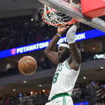Apr 3, 2026; Milwaukee, Wisconsin, USA; Boston Celtics center Neemias Queta (88) dunks the ball against the Milwaukee Bucks in the third quarter at Fiserv Forum. Mandatory Credit: Benny Sieu-Imagn Images