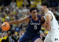 UConn Huskies forward Tarris Reed Jr. (5) backs down Michigan Wolverines center Aday Mara (15) on Monday, April 6, 2026, during the NCAA men’s basketball national championship game at Lucas Oil Stadium in Indianapolis. Credit: Grace Hollars/IndyStar / USA TODAY via Imagn Images