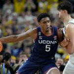 UConn Huskies forward Tarris Reed Jr. (5) backs down Michigan Wolverines center Aday Mara (15) on Monday, April 6, 2026, during the NCAA men’s basketball national championship game at Lucas Oil Stadium in Indianapolis. Credit: Grace Hollars/IndyStar / USA TODAY NETWORK via Imagn Images