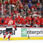 Apr 11, 2026; Chicago, Illinois, USA; Chicago Blackhawks center Ryan Greene (20) celebrates with teammates after scoring against the St. Louis Blues during the first period at United Center. Mandatory Credit: Kamil Krzaczynski-Imagn Images