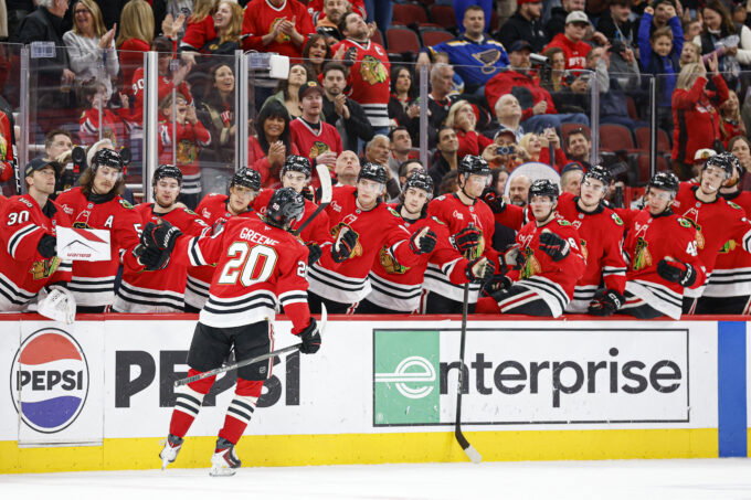 Apr 11, 2026; Chicago, Illinois, USA; Chicago Blackhawks center Ryan Greene (20) celebrates with teammates after scoring against the St. Louis Blues during the first period at United Center. Mandatory Credit: Kamil Krzaczynski-Imagn Images