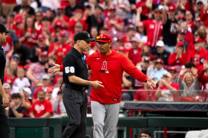 Los Angeles Angels manager Kurt Suzuki argues with an umpire in the eight inning between the Cincinnati Reds and the Los Angeles Angels at Great American Ball in Cincinnati on Saturday, April 11, 2026.