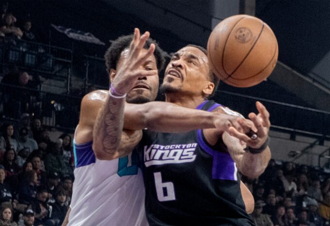 Stockton Kings’ DaQuan Jefferies, right, is fouled by Greensboro Swam’s Jonas Aidoo during the second game of the NBA G League basketball championship at the Adventist Health Arena in downtown Stockton on Apr. 10, 2026. The Kings lost 119-104.