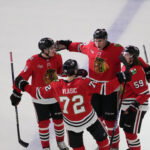 Apr 15, 2026; Chicago, Illinois, USA; Chicago Blackhawks defenseman Louis Crevier (46) celebrates his second goal against the San Jose Sharks with left wing Tyler Bertuzzi (59) during the third period at United Center. Mandatory Credit: David Banks-Imagn Images