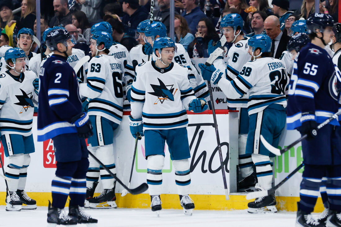Apr 16, 2026; Winnipeg, Manitoba, CAN; San Jose Sharks forward Philipp Kurashev (96) is congratulated by his team mates on his goal against the Winnipeg Jets during the second period at Canada Life Centre. Mandatory Credit: Terrence Lee-Imagn Images