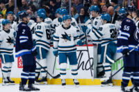 Apr 16, 2026; Winnipeg, Manitoba, CAN; San Jose Sharks forward Philipp Kurashev (96) is congratulated by his team mates on his goal against the Winnipeg Jets during the second period at Canada Life Centre. Mandatory Credit: Terrence Lee-Imagn Images