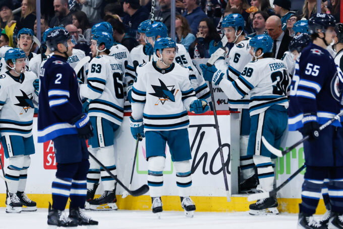 Apr 16, 2026; Winnipeg, Manitoba, CAN; San Jose Sharks forward Philipp Kurashev (96) is congratulated by his team mates on his goal against the Winnipeg Jets during the second period at Canada Life Centre. Mandatory Credit: Terrence Lee-Imagn Images