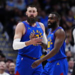 Apr 20, 2026; Denver, Colorado, USA; Denver Nuggets guard Tim Hardaway Jr. (10) and center Jonas Valanciunas (17) react in the first half against the Minnesota Timberwolves during game two of the first round of the 2026 NBA Playoffs at Ball Arena. Mandatory Credit: Ron Chenoy-Imagn Images