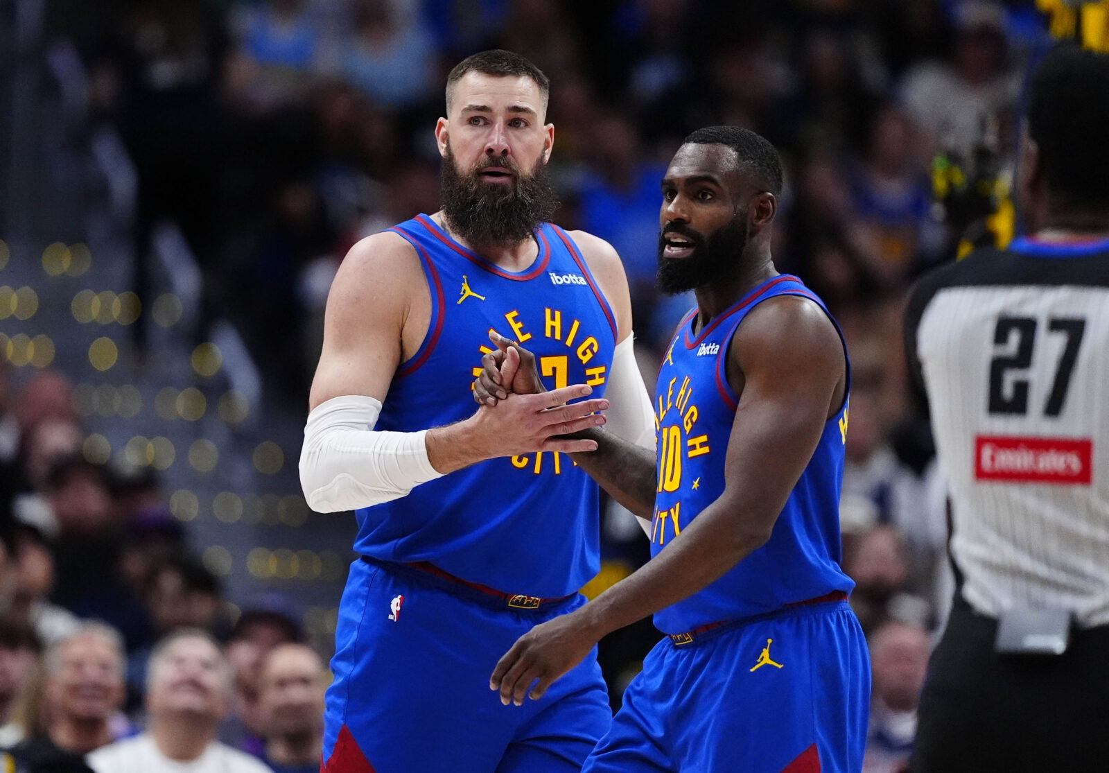 Apr 20, 2026; Denver, Colorado, USA; Denver Nuggets guard Tim Hardaway Jr. (10) and center Jonas Valanciunas (17) react in the first half against the Minnesota Timberwolves during game two of the first round of the 2026 NBA Playoffs at Ball Arena. Mandatory Credit: Ron Chenoy-Imagn Images