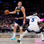 Apr 27, 2026; Denver, Colorado, USA; Denver Nuggets center Nikola Jokic (15) controls the ball as Minnesota Timberwolves forward Jaden McDaniels (3) defends in the third quarter during game five of the first round of the 2026 NBA Playoffs at Ball Arena. Mandatory Credit: Isaiah J. Downing-Imagn Images