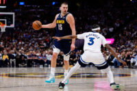 Apr 27, 2026; Denver, Colorado, USA; Denver Nuggets center Nikola Jokic (15) controls the ball as Minnesota Timberwolves forward Jaden McDaniels (3) defends in the third quarter during game five of the first round of the 2026 NBA Playoffs at Ball Arena. Mandatory Credit: Isaiah J. Downing-Imagn Images
