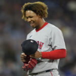 Apr 29, 2026; Toronto, Ontario, CAN; Boston Red Sox starting pitcher Brayan Bello (66) smiles as he comes of the field against the Toronto Blue Jays during the first inning at Rogers Centre. Mandatory Credit: John E. Sokolowski-Imagn Images