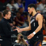 Apr 27, 2026; Phoenix, Arizona, USA; Phoenix Suns guard Devin Booker (1) with head coach Jordan Ott against the Oklahoma City Thunder during game four of the first round of the 2026 NBA Playoffs at Mortgage Matchup Center. Mandatory Credit: Mark J. Rebilas-Imagn Images