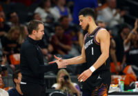Apr 27, 2026; Phoenix, Arizona, USA; Phoenix Suns guard Devin Booker (1) with head coach Jordan Ott against the Oklahoma City Thunder during game four of the first round of the 2026 NBA Playoffs at Mortgage Matchup Center. Mandatory Credit: Mark J. Rebilas-Imagn Images