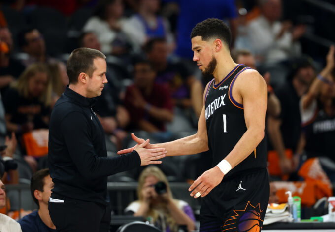 Apr 27, 2026; Phoenix, Arizona, USA; Phoenix Suns guard Devin Booker (1) with head coach Jordan Ott against the Oklahoma City Thunder during game four of the first round of the 2026 NBA Playoffs at Mortgage Matchup Center. Mandatory Credit: Mark J. Rebilas-Imagn Images