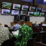 May 16, 2026; Laurel, MD, USA; Bettors view races in a betting parlor during the 151st Preakness Stakes day at Laurel Park. Mandatory Credit: Amber Searls-Imagn Images