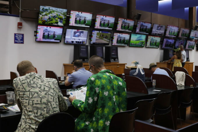 May 16, 2026; Laurel, MD, USA; Bettors view races in a betting parlor during the 151st Preakness Stakes day at Laurel Park. Mandatory Credit: Amber Searls-Imagn Images