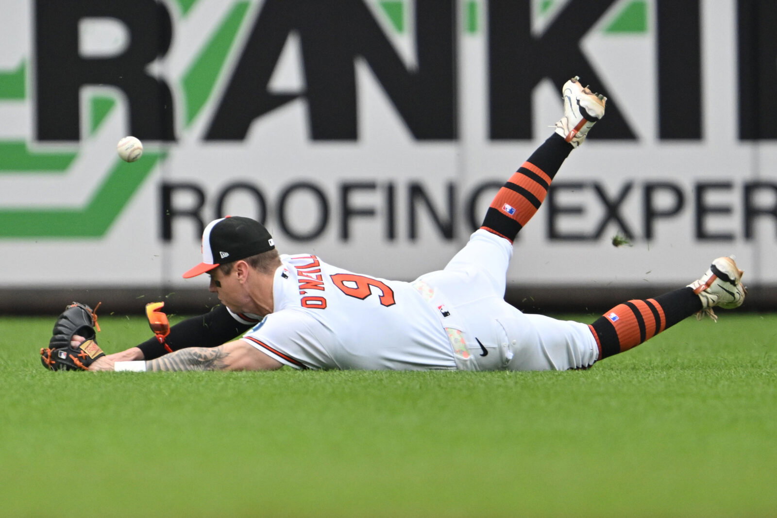 May 24, 2026; Baltimore, Maryland, USA; Baltimore Orioles outfielder Tyler O'Neill (9) is unable to make a diving catch of a short fly ball in the sixth inning against the Detroit Tigers at Oriole Park at Camden Yards. Mandatory Credit: Jamie Sabau-Imagn Images