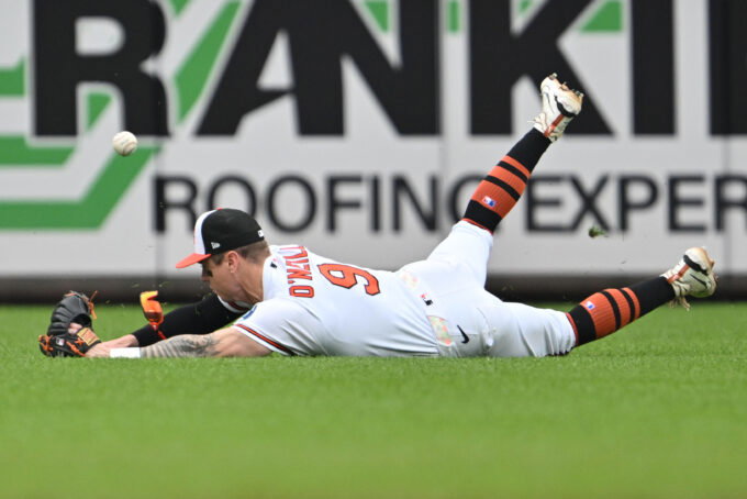 May 24, 2026; Baltimore, Maryland, USA; Baltimore Orioles outfielder Tyler O'Neill (9) is unable to make a diving catch of a short fly ball in the sixth inning against the Detroit Tigers at Oriole Park at Camden Yards. Mandatory Credit: Jamie Sabau-Imagn Images