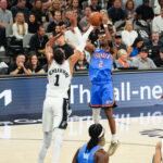 May 24, 2026; San Antonio, Texas, USA; Oklahoma City Thunder guard Shai Gilgeous-Alexander (2) shoots while defended by San Antonio Spurs center Victor Wembanyama (1) in the first quarter during game four of the western conference finals for the 2026 NBA playoffs at Frost Bank Center. Mandatory Credit: Scott Wachter-Imagn Images