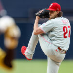 May 26, 2026; San Diego, California, USA; Philadelphia Phillies starting pitcher Aaron Nola (27) throws a pitch during the first inning against the San Diego Padres at Petco Park. Mandatory Credit: David Frerker-Imagn Images