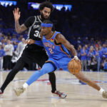 May 30, 2026; Oklahoma City, Oklahoma, USA; Oklahoma City Thunder guard Shai Gilgeous-Alexander (2) controls the ball against San Antonio Spurs forward Julian Champagnie (30) in the fourth quarter during game seven of the western conference finals for the 2026 NBA playoffs at Paycom Center. Mandatory Credit: Alonzo Adams-Imagn Images
